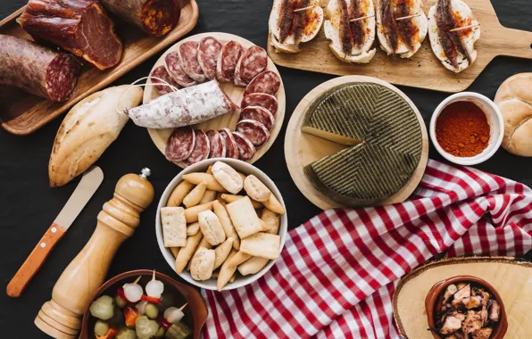 Fish, cheese, bread, vegetables, sausage, spices