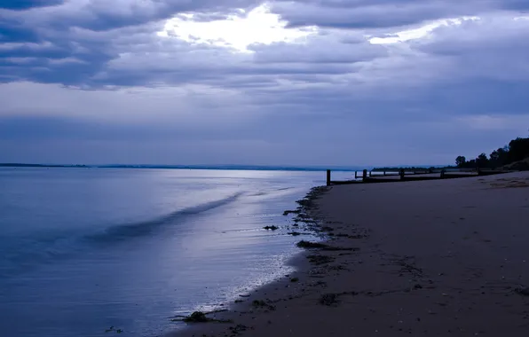 Sand, sea, clouds, posts, twilight