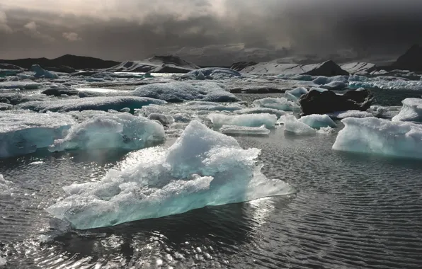 Ice, sea, mountains, storm, sunlight, gray clouds