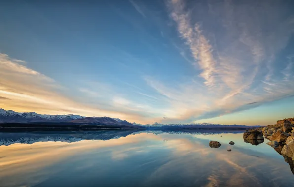 The sky, clouds, mountains, lake, reflection, stones, rocks