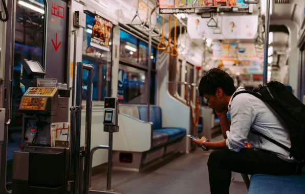 Boy, subway, cell phone, urban scene