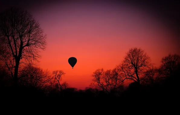 The sky, trees, sunset, balloon, silhouette, glow