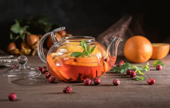 Glass, berries, the dark background, table, tea, oranges, kettle, fruit