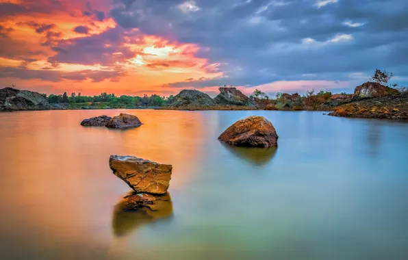 The sky, clouds, sunset, lake, stones