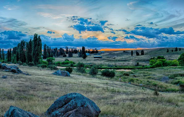 The sky, grass, clouds, trees, sunset, stream, stones, hills