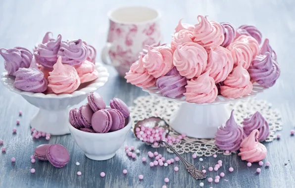 On the table, macarons, colored glaze, in a vase