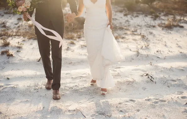 Sand, beach, the bride, the groom