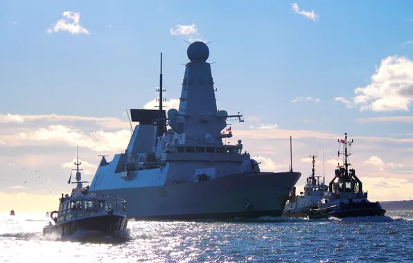 Sea, the sky, clouds, small ships, the destroyer "HMS Defender", the British Navy