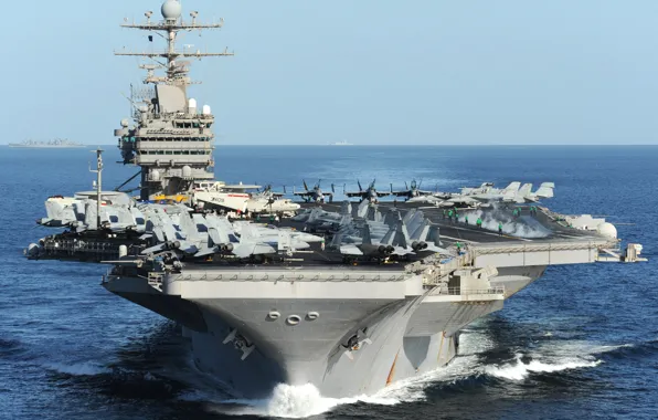 Picture the ocean, fighters, the carrier, Multipurpose, with nuclear power, USS Abraham Lincoln, the fifth ship …