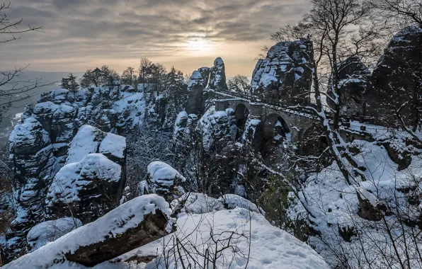Winter, the sun, clouds, snow, trees, mountains, branches, bridge
