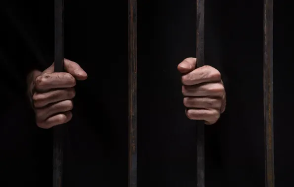 Hands, prison, bars, lack of freedom