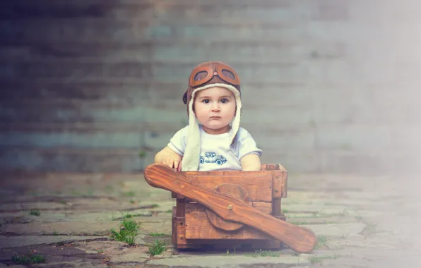 Boy, baby, pilot, box
