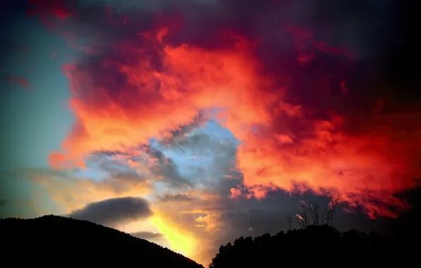 The sky, clouds, sunset, mountains, silhouette, glow