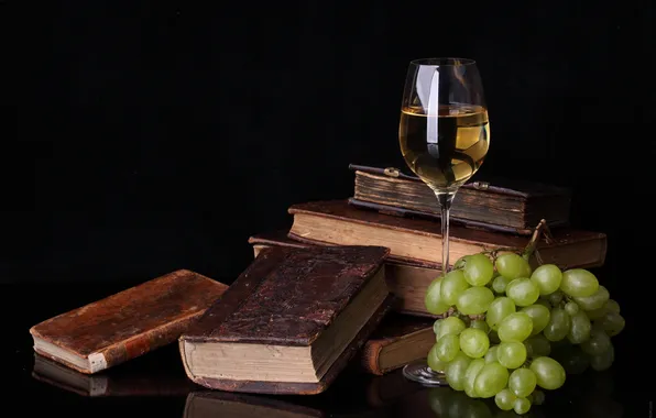 Table, wine, glass, books, grapes, food for thought