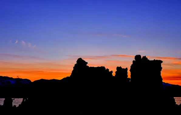 The sky, clouds, sunset, rocks, silhouette