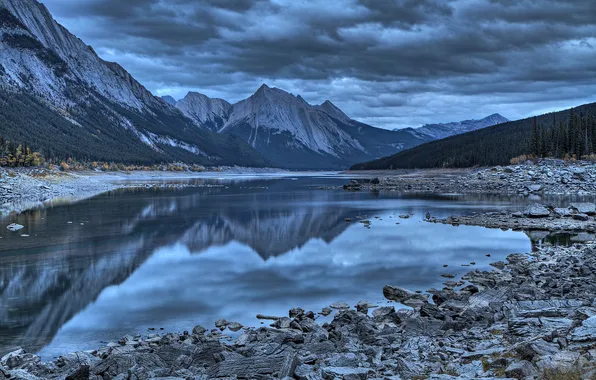 The sky, mountains, clouds, lake, stones