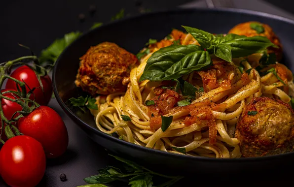 The dark background, table, food, plate, meat, tomatoes, dish, pasta