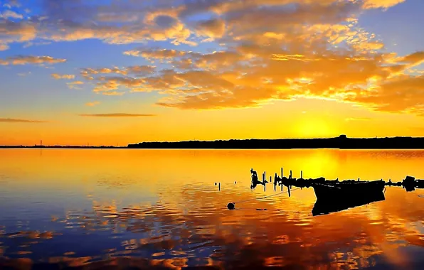 Picture the sky, clouds, sunset, lake, boat, silhouette