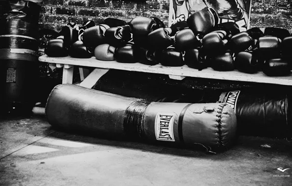 A Boxer Throws A Hard Punch At A Punching Bag In A Gym