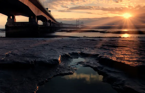 Picture sea, the sun, rays, bridge, stones, the ocean, shore