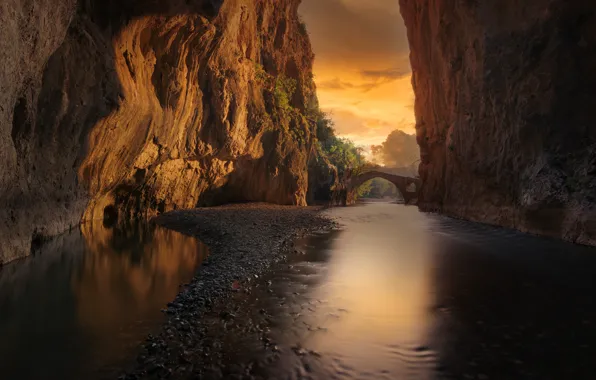 The sky, water, clouds, surface, light, trees, sunset, mountains