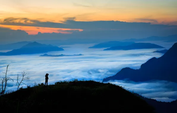The sky, clouds, sunset, mountains, fog, people, silhouette