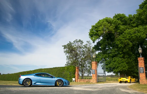 Picture the sky, clouds, trees, yellow, blue, gate, lights, ferrari