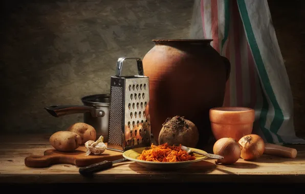 The dark background, table, food, towel, bow, plate, spoon, knife