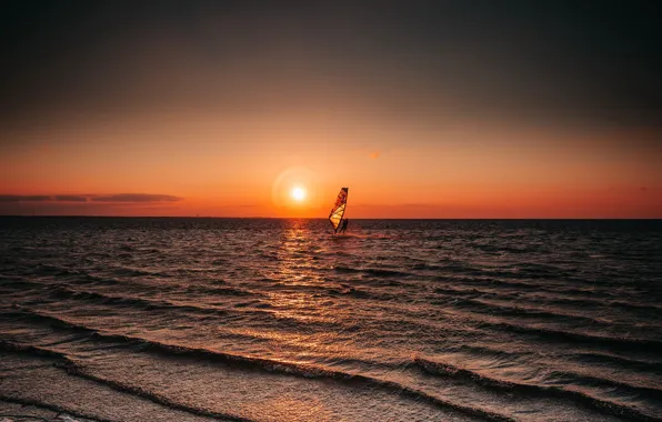 Picture sea, sunset, sailboarding