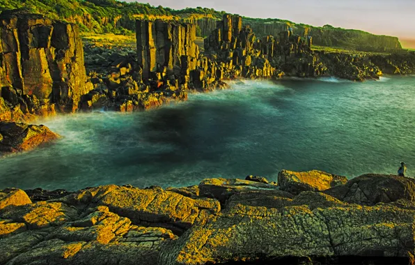 Picture sea, the sky, stones, rocks, fisherman