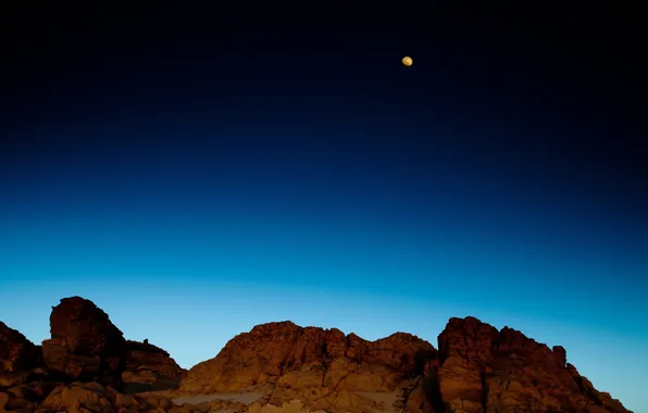 Picture the sky, mountains, rocks, the moon, blue, yellow
