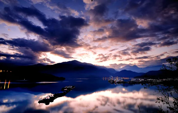 Picture the sky, water, clouds, mountains, lights, surface, reflection, blue
