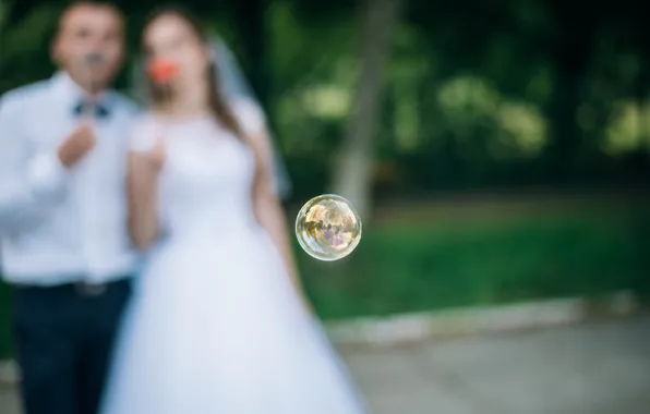 Picture the bride, the groom, bubble