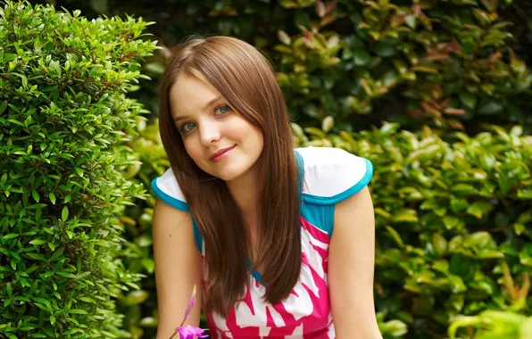 Picture greens, flower, look, girl, smile, foliage, dress, brown hair, the bushes, Emily, amelie, gray-eyed