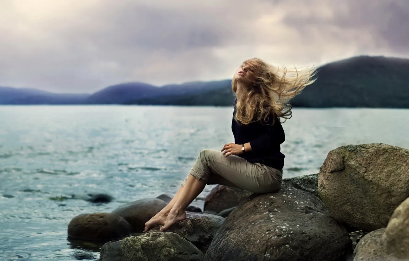 Photo wallpaper sea, girl, face, stones, photo, the wind, shore, hair