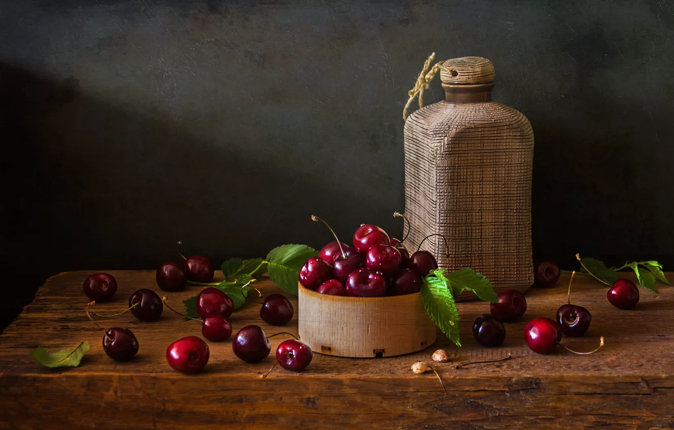 Photo wallpaper leaves, light, cherry, berries, the dark background, table, bottle, wooden