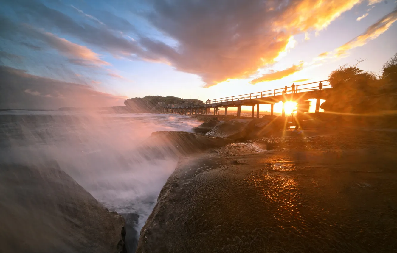 Photo wallpaper the sun, clouds, sunset, squirt, bridge, stones, rocks, people