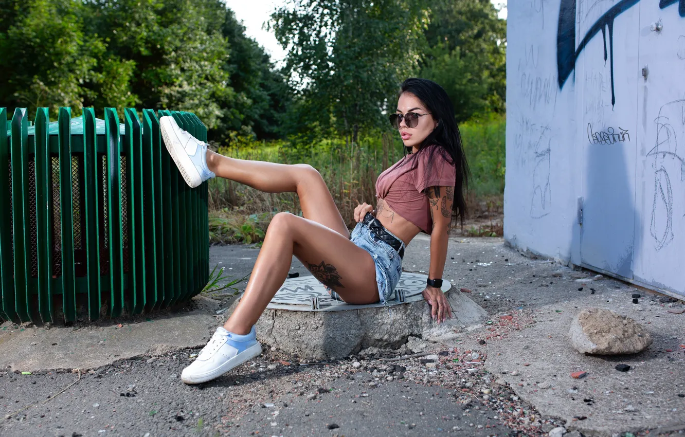 Photo wallpaper girl, pose, feet, shorts, brunette, glasses, sneakers, Sergey Pak