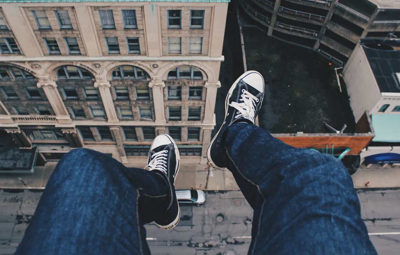 Photo wallpaper roof, street, feet, height, sneakers, jeans, guy, on the edge