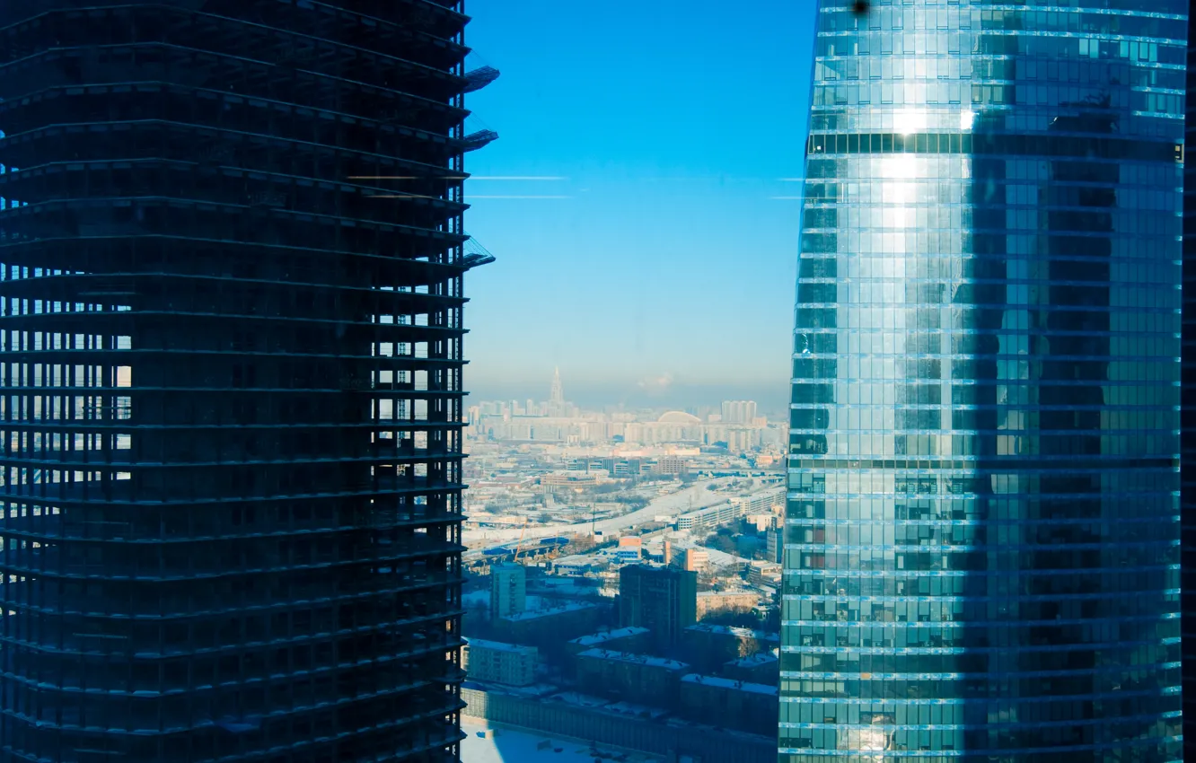 Photo wallpaper winter, the sky, glass, snow, construction, building, skyscrapers, horizon