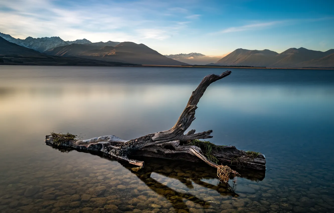 Photo wallpaper the sky, mountains, pebbles, shore, the bottom, snag, pond