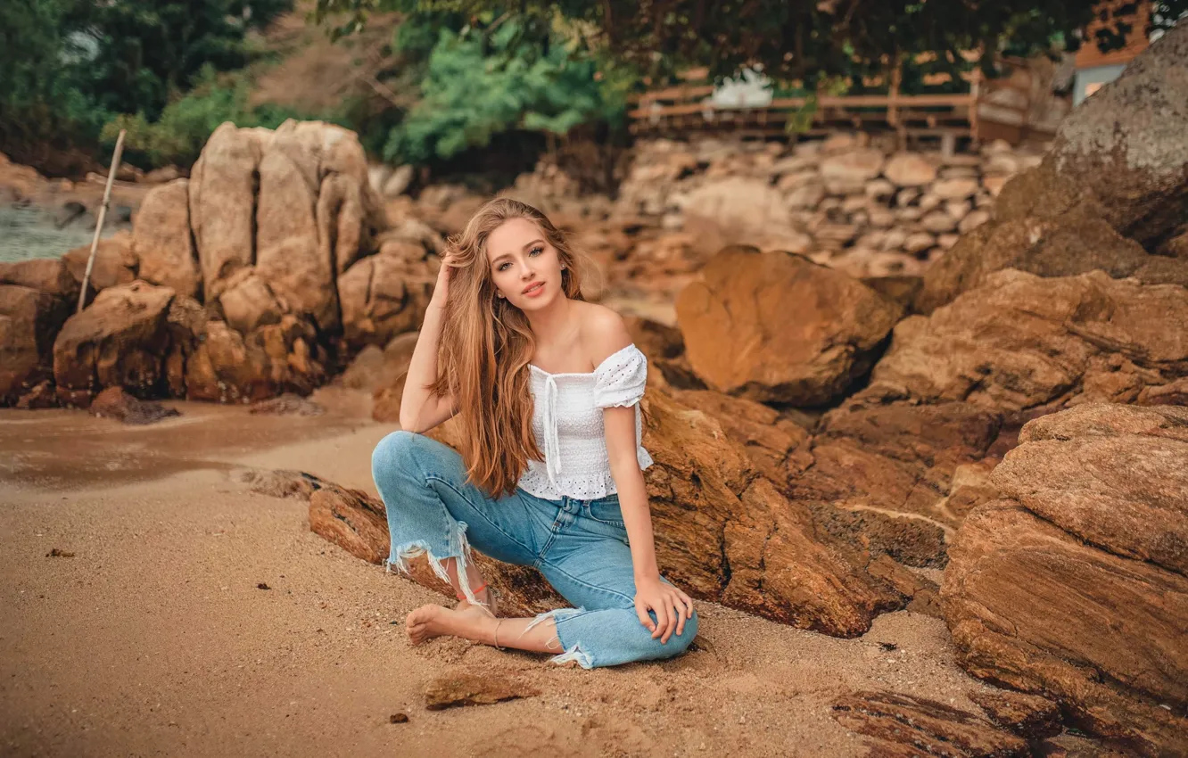 Photo wallpaper sand, girl, nature, pose, stones, jeans, barefoot, blouse