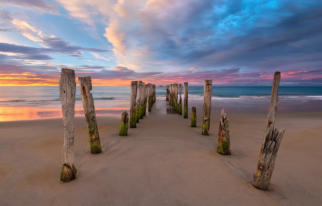 Photo wallpaper sea, beach, clouds, posts, morning, New Zealand