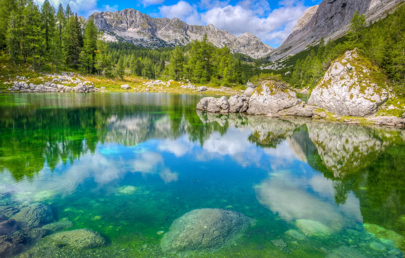 Photo wallpaper the sky, trees, mountains, lake, stones, rocks, Alps, Slovenia