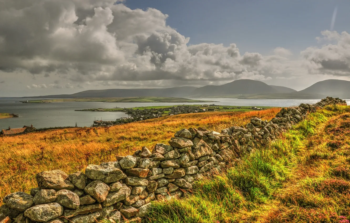 Photo wallpaper autumn, the sky, grass, mountains, clouds, lake, stones, the fence