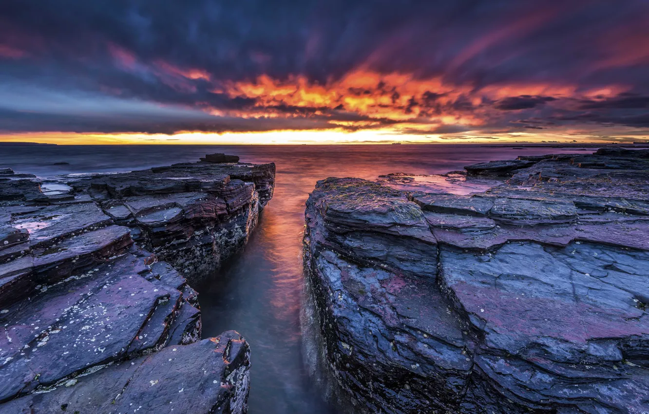 Photo wallpaper sea, the sky, clouds, sunset, stones, rocks, horizon, glow