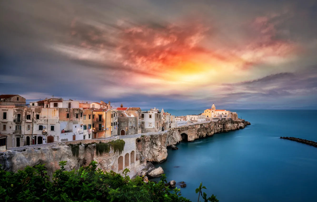 Photo wallpaper sea, clouds, sunset, the city, shore, coast, view, building