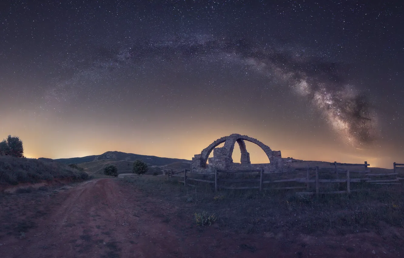 Photo wallpaper road, field, stars, night, hills, the fence, the fence, arch
