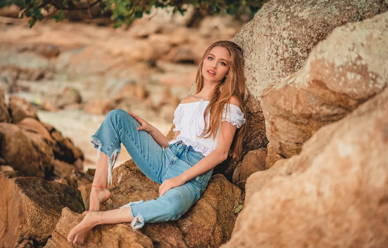 Photo wallpaper girl, pose, stones, jeans, barefoot, blouse, shoulders, barefoot