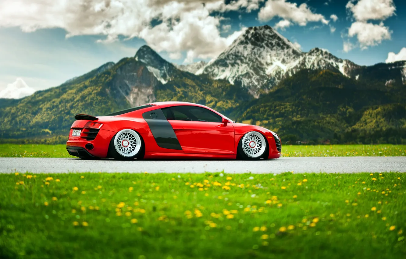 Photo wallpaper grass, flowers, mountains, Audi, red, landing, suspension, stancenation